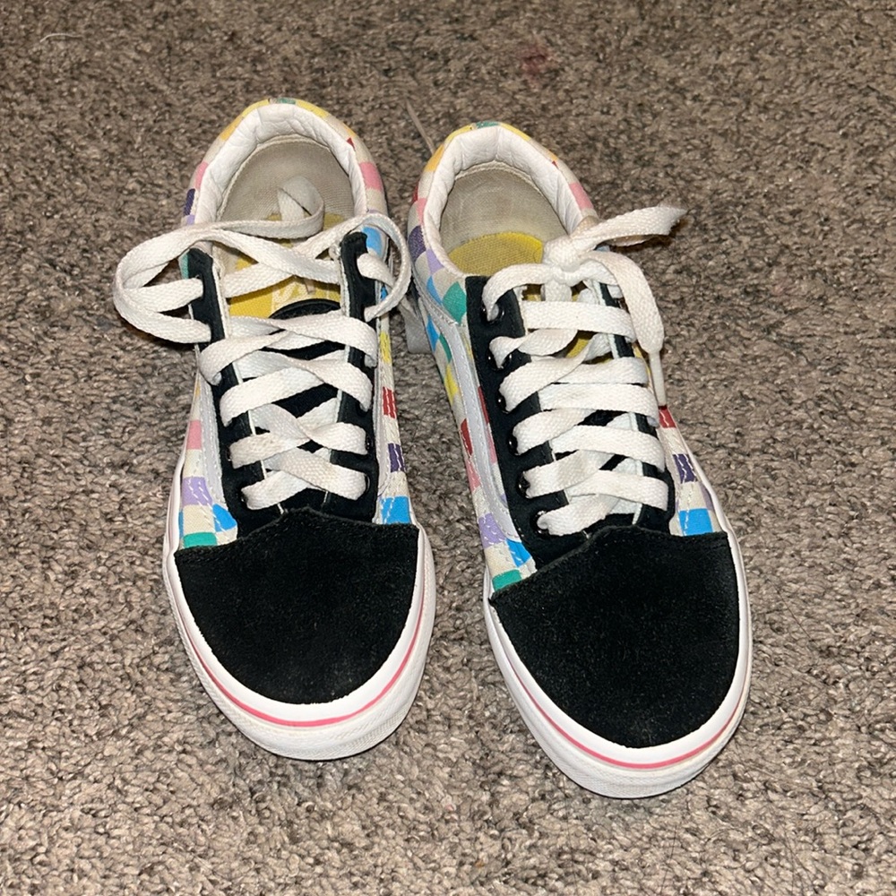 Black and rainbow colored vans